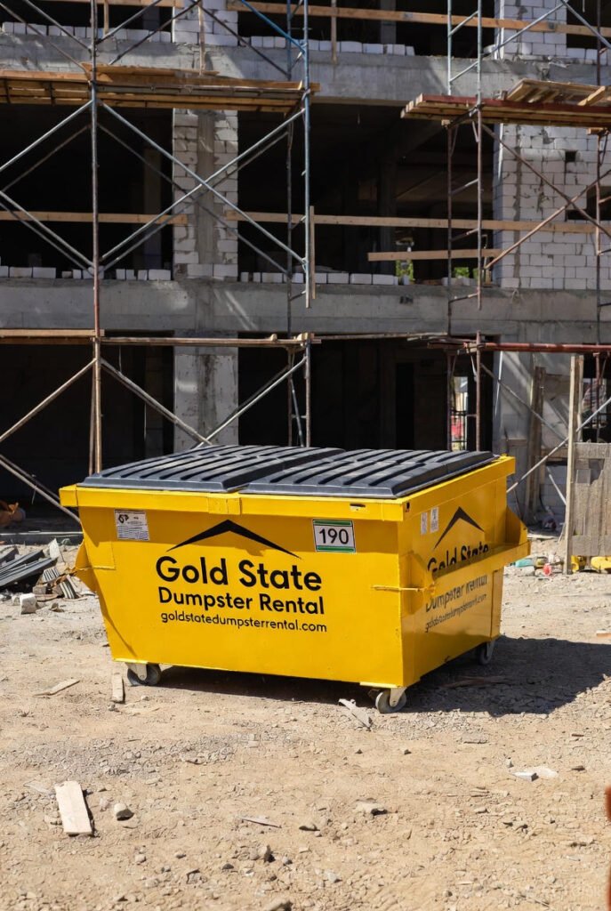 Gold state dumpster rental branded dumpster construction zone
